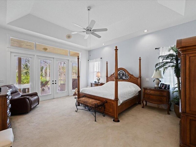 carpeted bedroom featuring ceiling fan, a textured ceiling, access to outside, and french doors