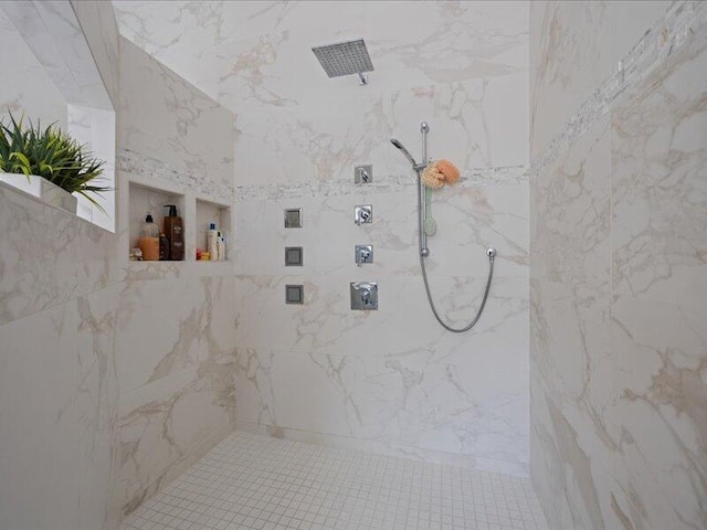 bathroom with tiled shower