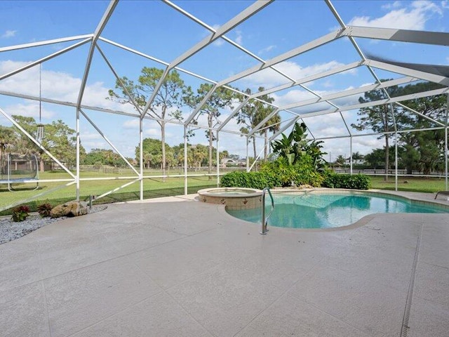 view of pool with a lanai, a patio area, and a yard