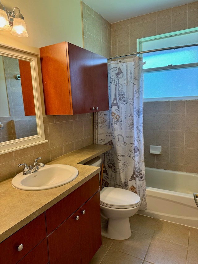 full bathroom featuring toilet, tile patterned floors, vanity, backsplash, and shower / bath combo with shower curtain