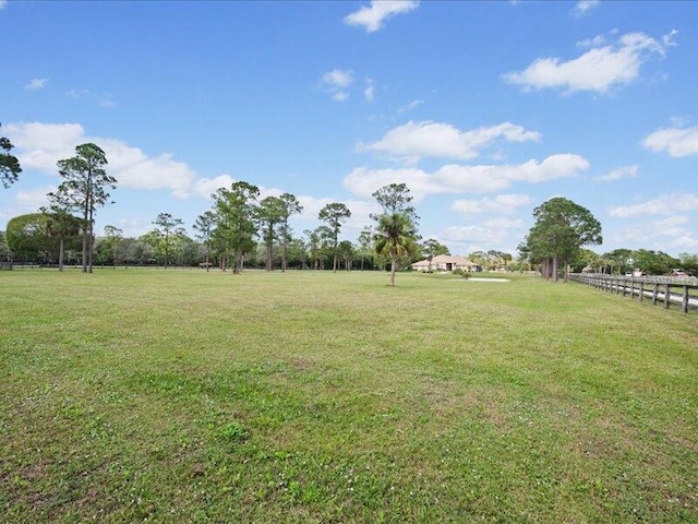 view of yard with a rural view