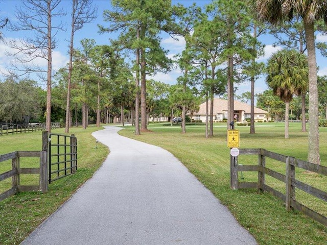 view of property's community with a lawn