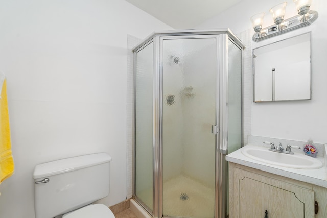 bathroom with toilet, a shower with door, and vanity