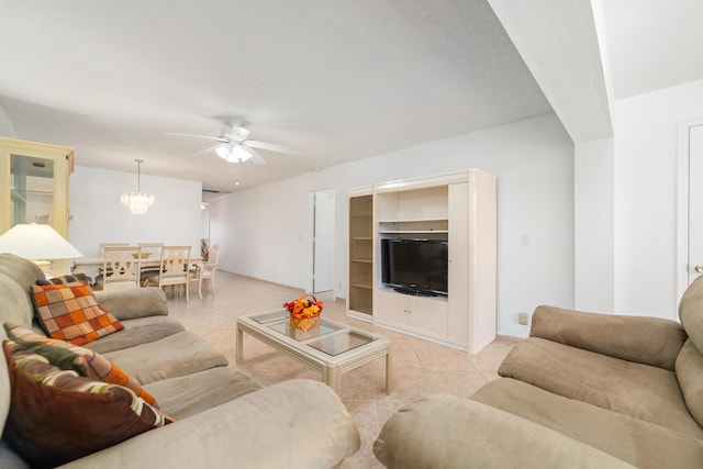 living room with ceiling fan and light tile patterned flooring