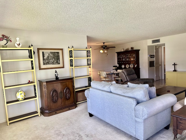 767 E High Point Dr E Unit C, Delray Beach, FL 33445 - carpeted living area featuring a ceiling fan and a textured ceiling