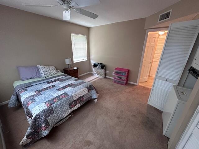 carpeted bedroom with ceiling fan, visible vents, and baseboards