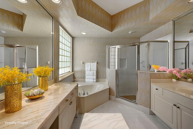 bathroom featuring tile patterned flooring, vanity, and independent shower and bath