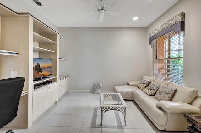 tiled living room with ceiling fan