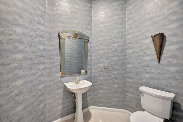 bathroom with tile patterned flooring and toilet