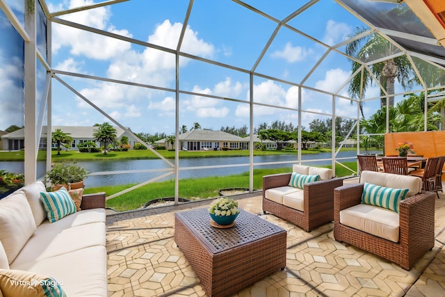 view of patio featuring outdoor lounge area, a water view, and a lanai