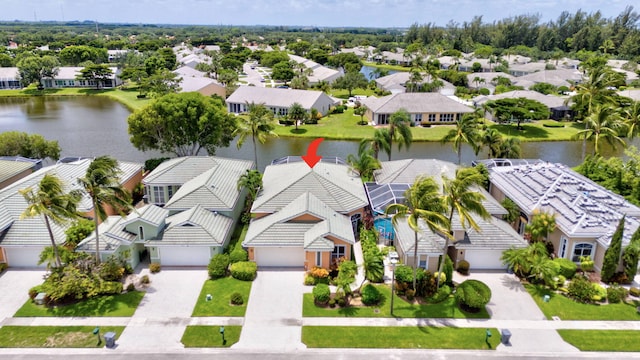 birds eye view of property featuring a water view