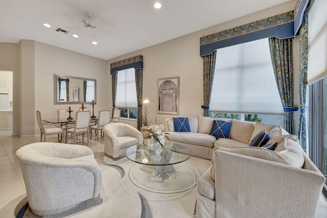 living room with ceiling fan and light tile patterned floors