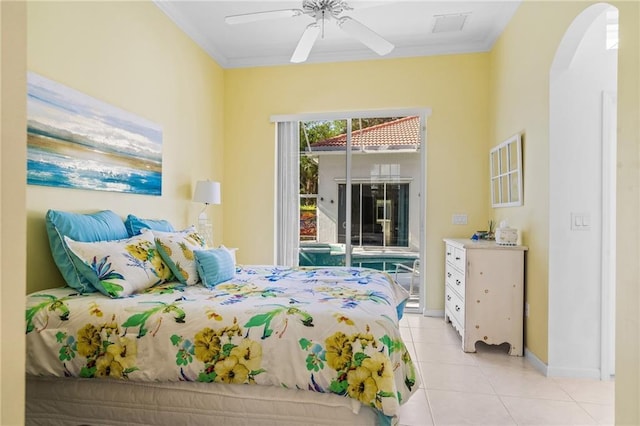 tiled bedroom with ceiling fan, ornamental molding, and access to outside