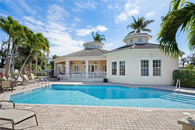 view of pool featuring ceiling fan and a patio