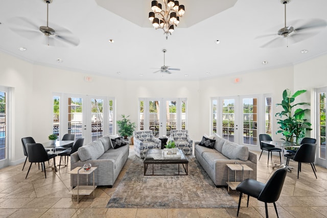 living room featuring an inviting chandelier and french doors