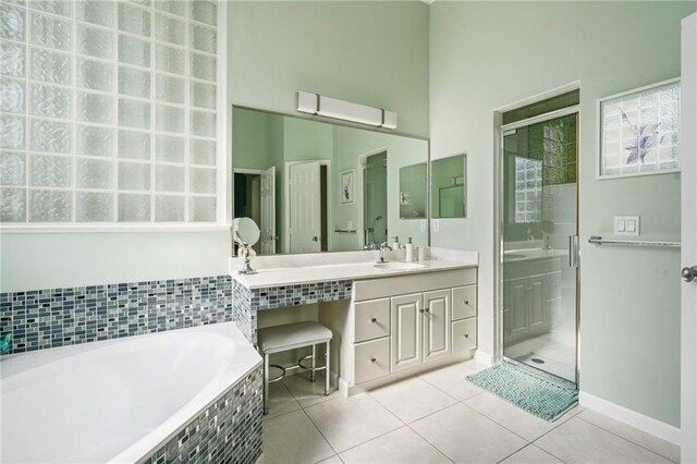 bathroom with vanity, a wall mounted AC, tile patterned floors, and shower with separate bathtub