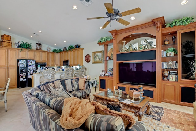 living room featuring ceiling fan, built in features, and vaulted ceiling