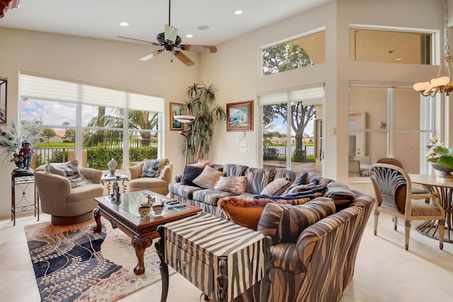 11420 Ohanu Cir, Boynton Beach, FL 33437 - living room featuring ceiling fan, plenty of natural light, recessed lighting, a high ceiling, and a chandelier
