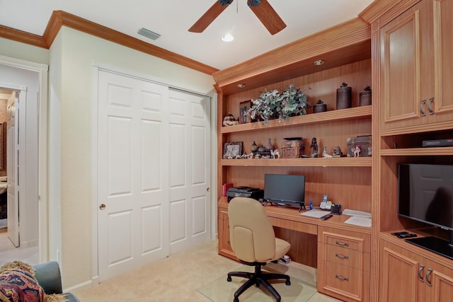 home office with ceiling fan, light colored carpet, and crown molding