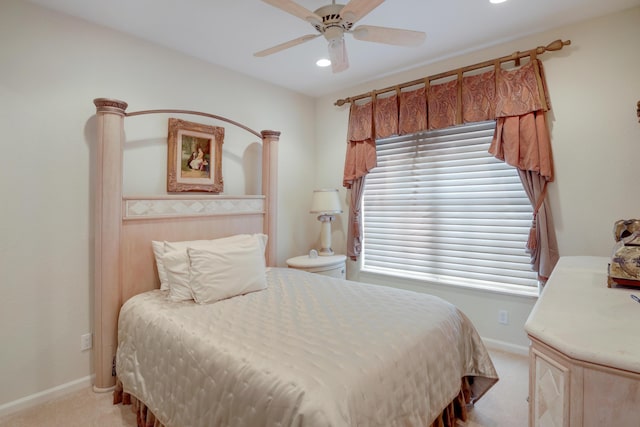 bedroom featuring ceiling fan and light carpet