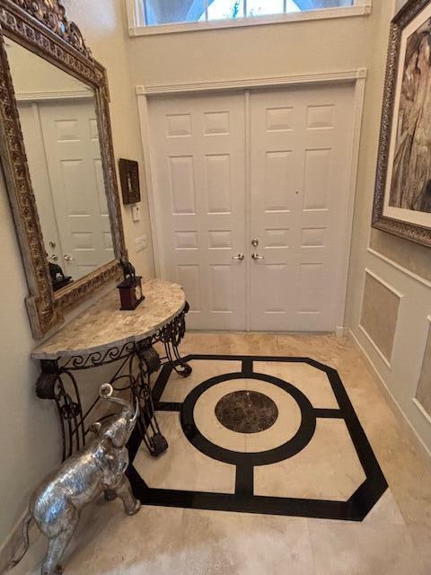 11420 Ohanu Cir, Boynton Beach, FL 33437 - foyer entrance with a high ceiling and inlaid floor details