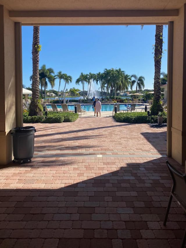 11420 Ohanu Cir, Boynton Beach, FL 33437 - view of patio / terrace featuring a community pool