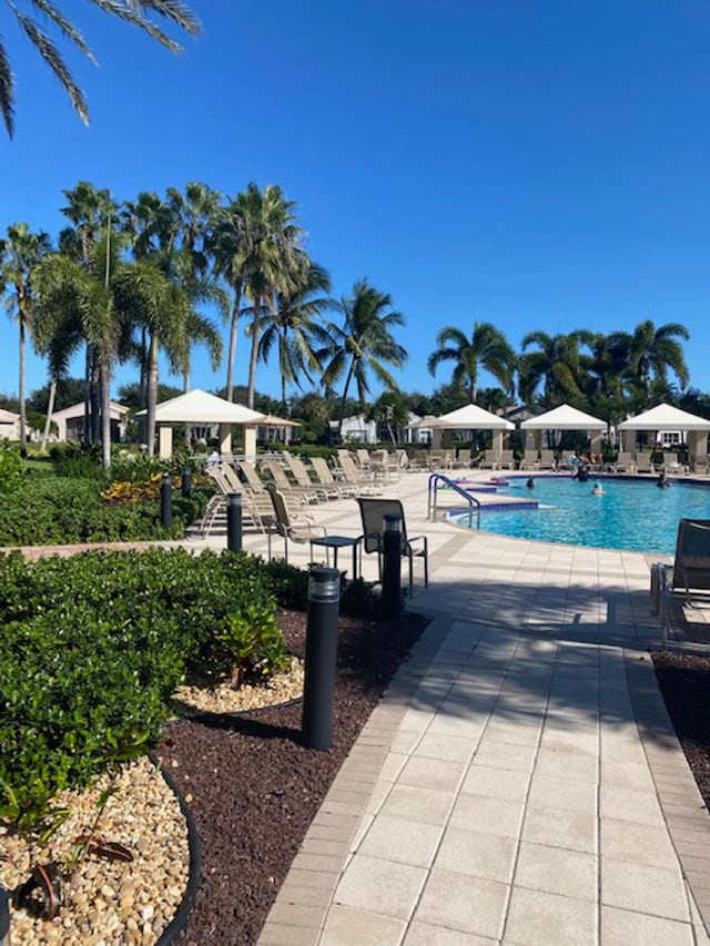 view of swimming pool featuring a gazebo and a patio