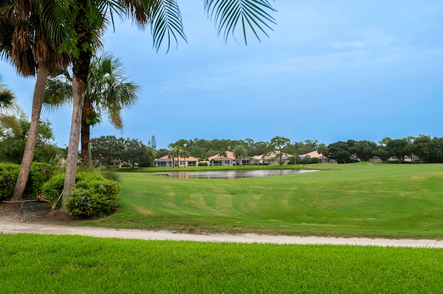 view of community featuring a yard and a water view