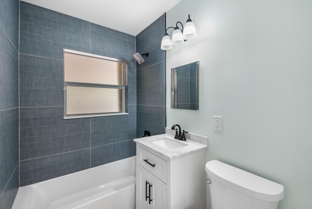 full bathroom with vanity, toilet, and tiled shower / bath combo