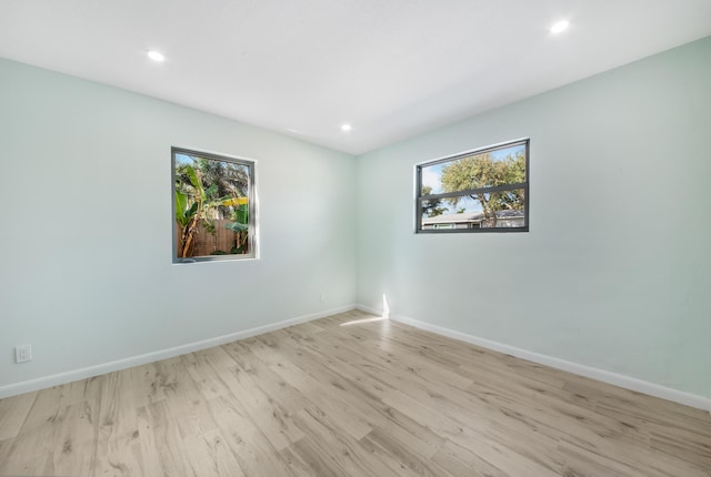 unfurnished bedroom featuring a closet and light hardwood / wood-style flooring