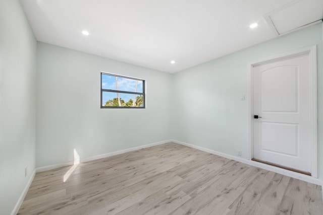 unfurnished room with light hardwood / wood-style floors