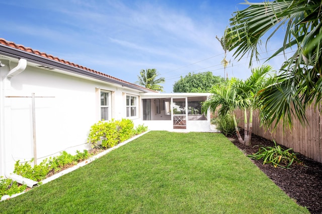 view of yard featuring a sunroom