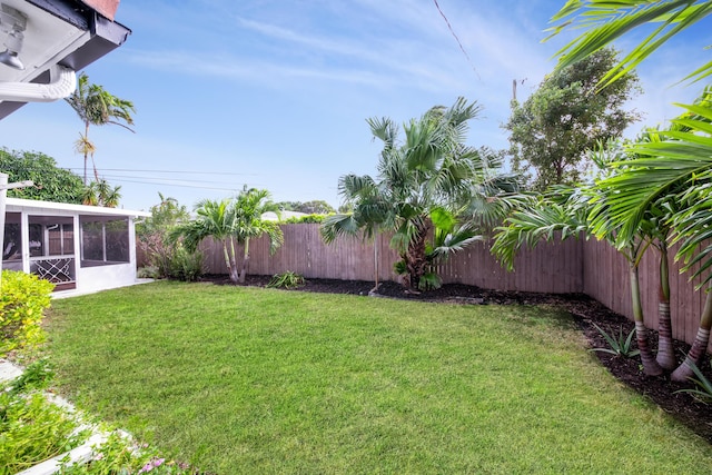 view of yard featuring a sunroom