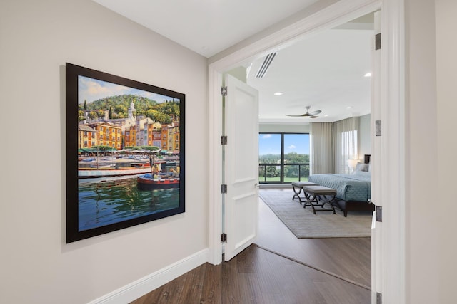 corridor featuring hardwood / wood-style flooring