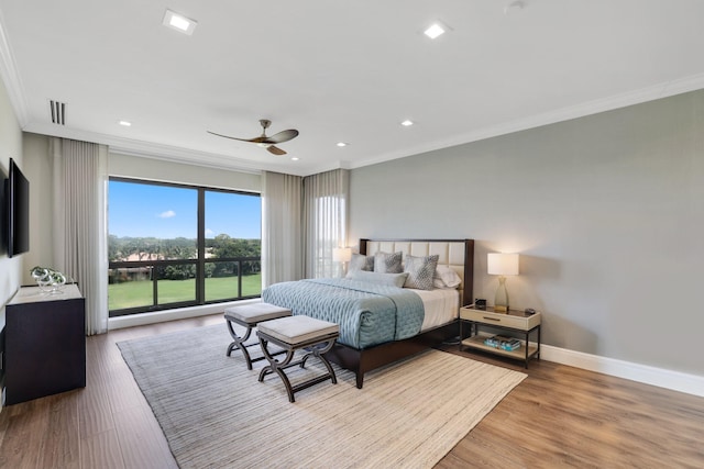 bedroom featuring ornamental molding, light hardwood / wood-style floors, and ceiling fan