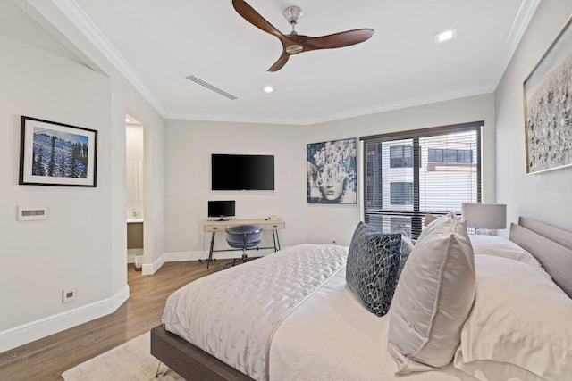 bedroom featuring ceiling fan, hardwood / wood-style flooring, and crown molding