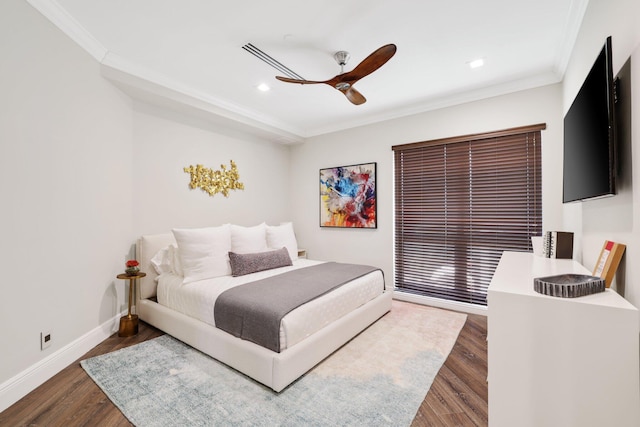 bedroom featuring ornamental molding, dark hardwood / wood-style floors, and ceiling fan