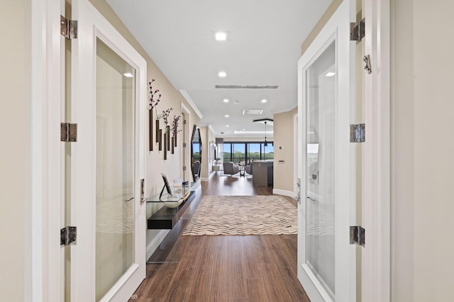 hall featuring french doors and dark hardwood / wood-style flooring