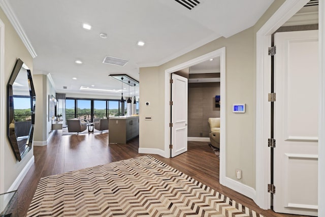 hallway with crown molding and wood-type flooring