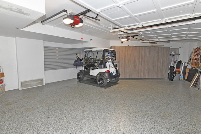 garage featuring a garage door opener