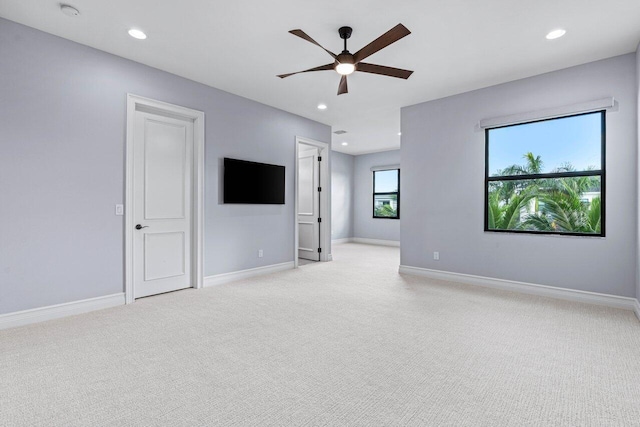 interior space with ceiling fan