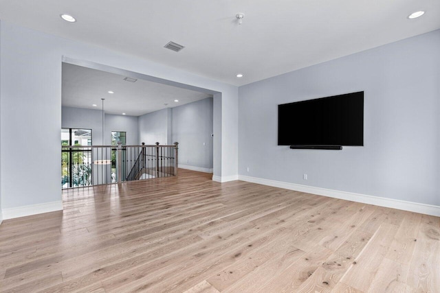 unfurnished living room with light wood-type flooring