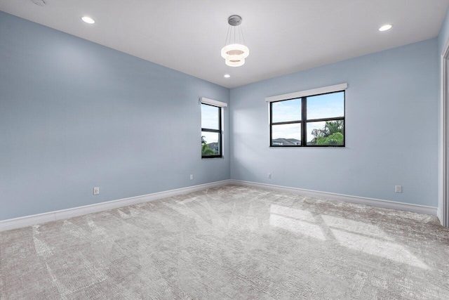 spare room with light carpet