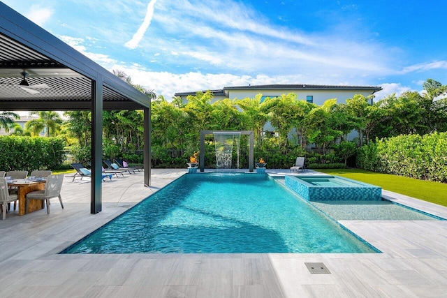 view of swimming pool with a patio area and an in ground hot tub