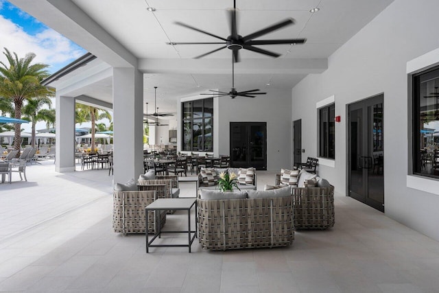 view of patio / terrace featuring ceiling fan and an outdoor living space