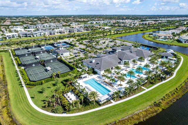 birds eye view of property with a water view