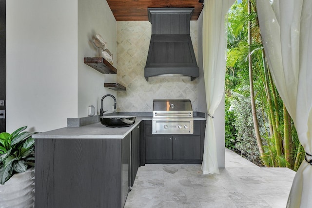 view of patio / terrace with area for grilling, sink, and an outdoor kitchen