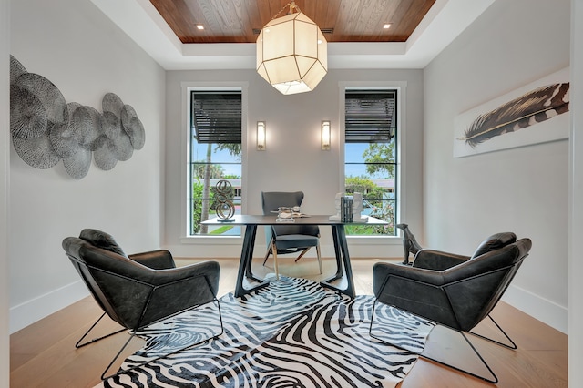 home office featuring wood ceiling, a raised ceiling, and a wealth of natural light