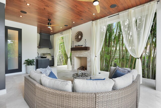 living room with ceiling fan, wooden ceiling, and light tile patterned floors