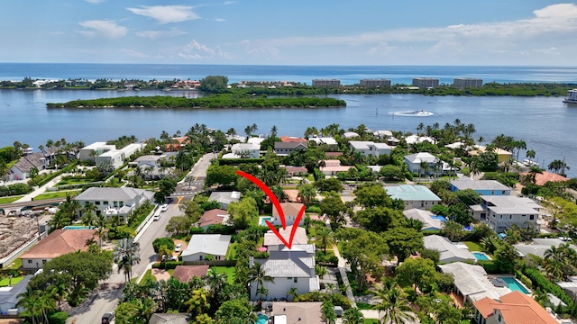 birds eye view of property featuring a water view